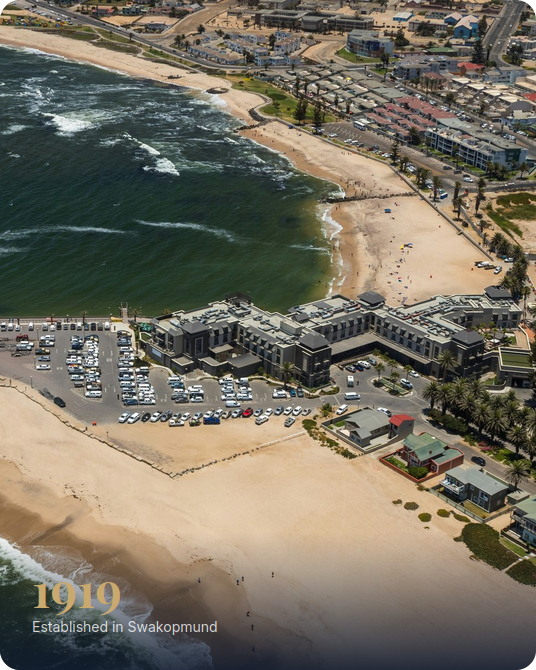 Aerial view of Swakopmund beach and coastline with 1919 Established in Swakopmund overlay